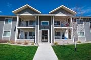 Bozeman apartment for rent - a building with a sidewalk in front of it at Madison Park, Bozeman, MT