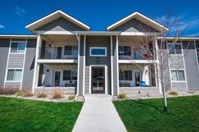 Bozeman apartment for rent - a building with a sidewalk in front of it at Madison Park, Bozeman, MT