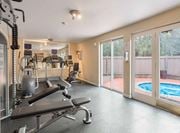 Mountlake Terrace apartment for rent - a gym with weights and a pool in the corner at Quartz Creek, Washington
