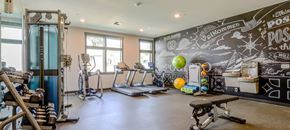 Poulsbo townhouse for rent - a workout room with cardio equipment and a chalkboard wall in a home gym at Woodcreek, Washington