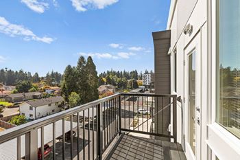 The view from the balcony of a home with a balcony railing