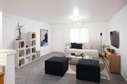 Lewiston apartment for rent - Bright living room with taupe carpet, white walls and door and window at opposite end.at Canyon View, Idaho, 83501