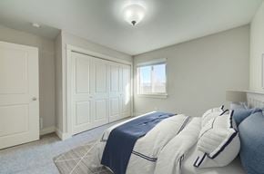 Bozeman townhouse for rent - a bedroom with a bed and a window at Copper Pines, Bozeman, MT 