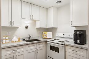 Wenatchee apartment for rent - a kitchen with white cabinets and white appliances at Park View Apartments, Wenatchee