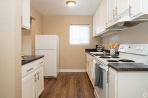 Woodland apartment for rent - a kitchen with white appliances and white cabinets at Ella 1711 Apartments, Woodland, 95695