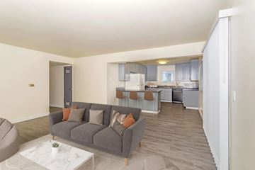 Chico apartment for rent - A living room with a grey couch and a coffee table.