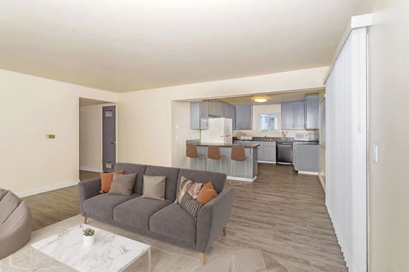 Chico apartment for rent - Open-concept living room with couch and coffee table in student apartments at Gateway Chico