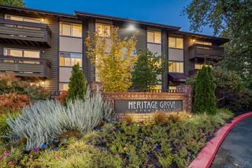 Renton apartment for rent - A building with a sign that says Heritage Grove.