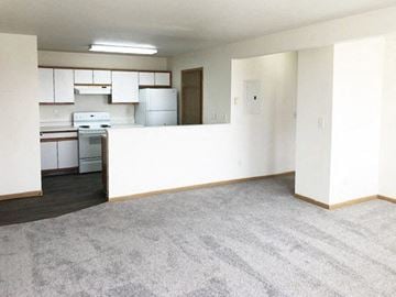 Belgrade apartment for rent - A kitchen with white cabinets and appliances is visible through a doorway.