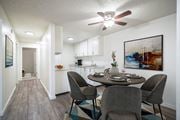 Pocatello apartment for rent - a dining area with a table and chairs and a kitchen in the background at Kirkwood Meadows, Idaho, 83201