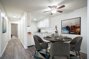 Pocatello apartment for rent - a dining area with a table and chairs and a kitchen in the background at Kirkwood Meadows, Idaho, 83201