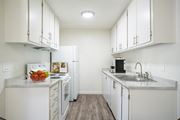 Pocatello apartment for rent - a kitchen with white cabinets and white appliances at Kirkwood Meadows, Pocatello, ID