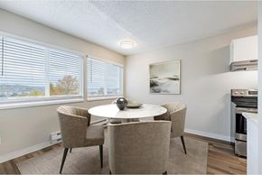 Renton apartment for rent - Dining area at Peak 88 Apartments in Renton, WA with table seating and open layout