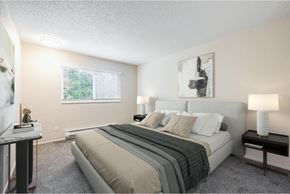 Renton apartment for rent - Two-bedroom apartment bedroom at Peak 88 Apartments in Renton, WA with neutral tones and natural light