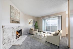 Renton apartment for rent - Living room at Peak 88 Apartments in Renton, WA featuring a fireplace and open-concept layout