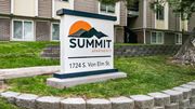 Pocatello apartment for rent - a sign for summit apartments in front of a building at Summit, Idaho, 83201