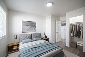 Pocatello apartment for rent - a bedroom with a bed and a closet at Summit, Pocatello, ID 83201