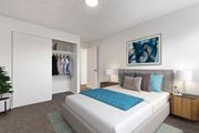 Boise apartment for rent - a bedroom with a white bed and a blue blanket