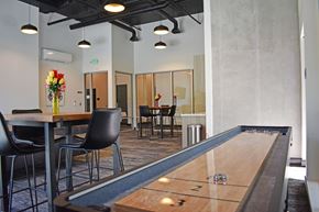 University Place apartment for rent - Resident lounge with shuffleboard at The Duo Apartments in University Place, WA.