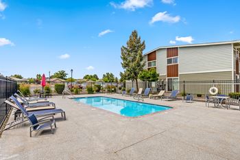Our apartments have a pool and lounge chairs  at wildflower, kennewick, wa, 99336