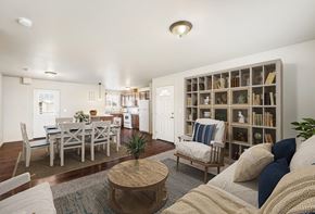Kennewick apartment for rent - Spacious living room opens into the dining area with a door to the balcony. Staged with couch, coffee table, and 2 chairs. at Pine Tree Park, Kennewick, WA