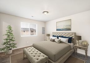 Kennewick apartment for rent - Carpeted bedroom with large double window, staged with queen-size bed, side tables, lamps, and a rug. at Pine Tree Park, Kennewick, 99337