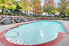 Everett apartment for rent - Small outdoor pool with red trim at Sunrise Lane Apartments Everett WA