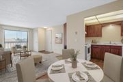 Moses Lake apartment for rent - Open dining area with four-seat table next to the living room in a 2 bed 1 bath floor plan at the Lakes in Moses Lake