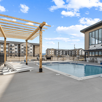 Pool area surrounded by lounge chairs