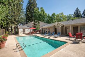Fair Oaks apartment for rent - Outdoor swimming pool area with tables and chairs