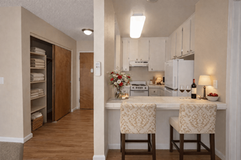 Kitchen with breakfast bar and linen storage