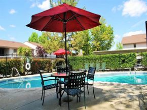Fair Oaks apartment for rent - Outdoor swimming pool area with table and chairs