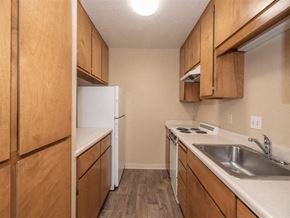 Lodi apartment for rent - Full kitchen with refrigerator, cabinets and counter space at Lodi Commons Senior Living, California, 95240