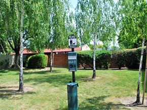 Lodi apartment for rent - Trees and grass with a dog waste station