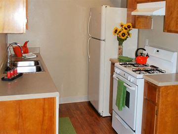 Lodi apartment for rent - A kitchen with a white stove and a white refrigerator.