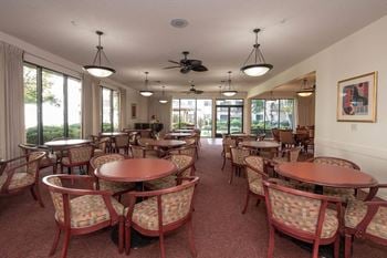 Bright community dining space with large windows