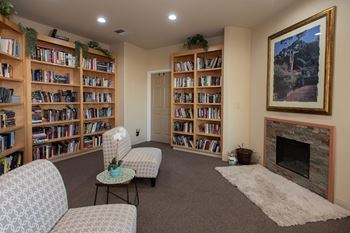 Library with built in bookcases and cozy seating