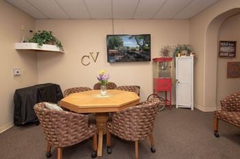 Room with octagonal table and popcorn machine