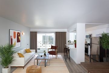 Los Angeles apartment for rent - a living room with a white couch and a table