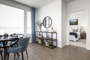 Denver apartment for rent - a living room and dining room with a bedroom in the background