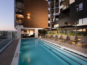 Gardena apartment for rent - Outdoor pool area at night with lounge seating