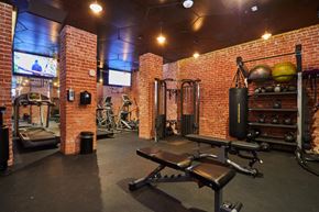 Hollywood apartment for rent - Fitness center with brick walls and cardio and weightlifting equipment