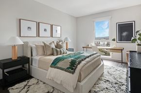Los Angeles apartment for rent - A bedroom with a large bed and a view of the city.