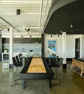 Los Angeles apartment for rent - A modern dining room with a glass table and chairs.
