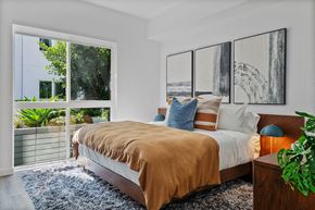 Los Angeles apartment for rent - a bedroom with a bed and a large window
