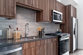 Los Angeles apartment for rent - a kitchen with wood cabinets and stainless steel appliances and a sink
