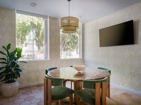 Woodland Hills apartment for rent - a dining room with a table and chairs and a tv