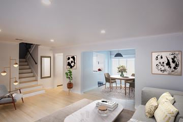 West Hollywood apartment for rent - a living room with a couch and a table and stairs