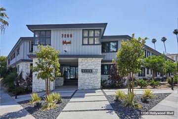 Los Angeles apartment for rent - the front of a house with trees and a sidewalk