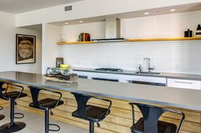 Portland apartment for rent - Rooftop indoor clubhouse with counter and chairs next to kitchen